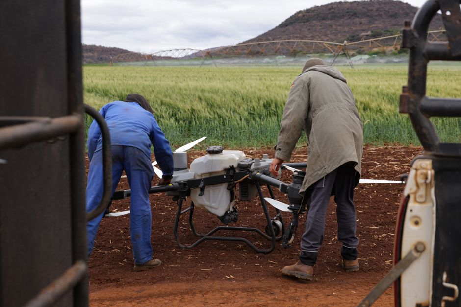 A commercial drone surveying a highway for inspection purposes, highlighting efficiency and safety in road maintenance.